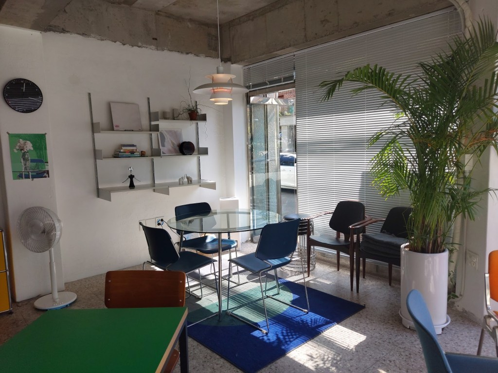 Sunlight coming in through the window, illuminating a table and chairs